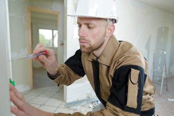 builder screws in a wall