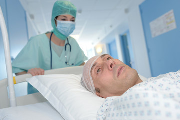 medical team carrying patient to surgery