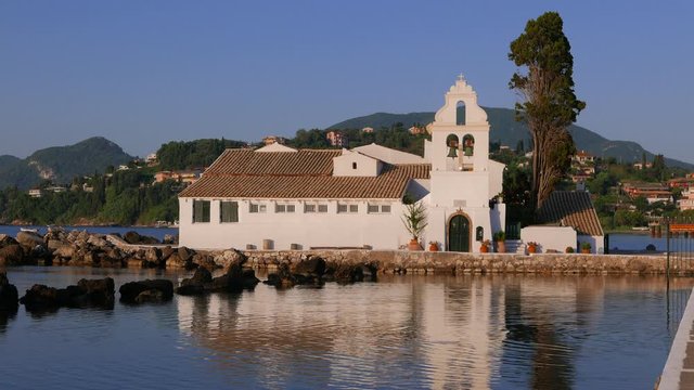 Church of St. Vlacherna. Early morning. The coast of Corfu, Cape Kanoni, Greece. Mediterranean
