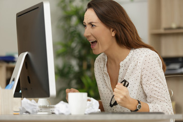 woman shouting into pc