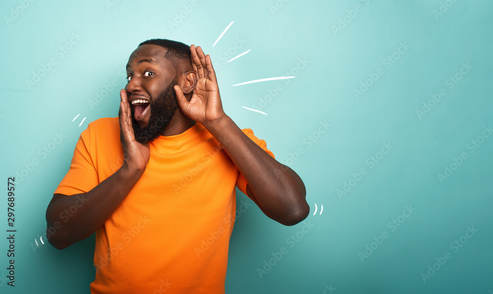 Wall mural man hears a secret notice. concept of curiosity and gossip. amazed expression