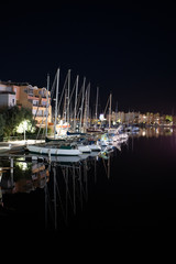 Boats and Yachts in a bay on the Rocky Tropical Ocean Island