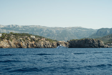 Fototapeta na wymiar View from the yacht to the Balearic Islands. Beautiful landscape in the Mediterranean Sea