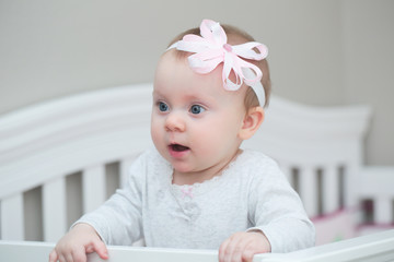 Close up Portrait of 7 Month Old Baby Girl with Flower hairband, Happy Cute Baby with Big Blue Eyes, Happy  family concept, The most Beautiful Girl, Princesses 