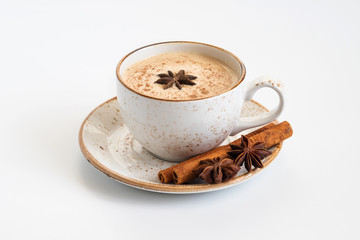 Indian Masala chai tea. Traditional Indian hot drink with milk and spices on white concrete background closeup. - obrazy, fototapety, plakaty