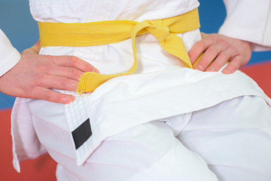 closeup of yellow belt around waist of kimono