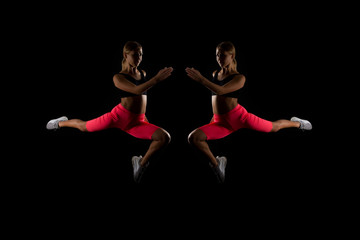 Fototapeta na wymiar Frozen in motion. Reflection woman athlete run jump fly. How run faster. Speed training guide. Improve run speed. Girl runner on black background. Sport lifestyle and health concept. Start run