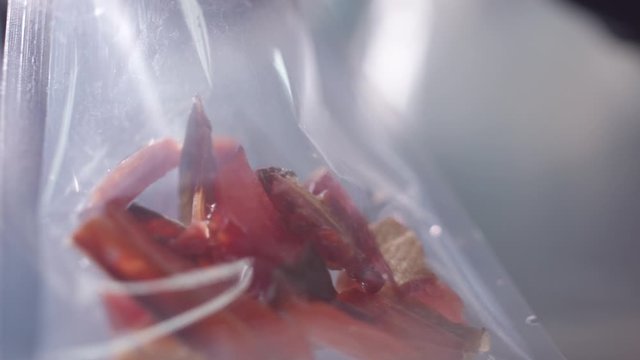 Packed in plastic vacuum bags of dried pieces of elk in a fish workshop