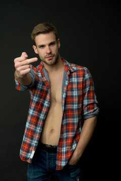 Rude behavior. Middle finger gesture. Man sexy muscular torso wear checkered shirt. Western style. Sexy macho black background. Handsome man with beard. Male fashion. Casually sexy. Feeling confident