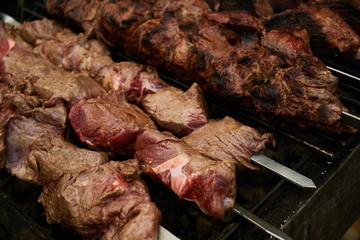 grilled meat on skewers lies on the grill, BBQ
