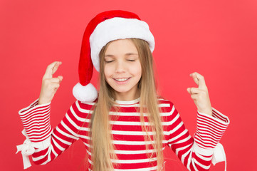 Hope for best. Christmas party. Cheerful girl having fun christmas eve. Best wishes. Child santa costume believe in miracle. Girl little kid on red background. Merry christmas and happy new year