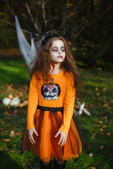 Girl dressed in zombies, wearing a costume for Halloween orange.