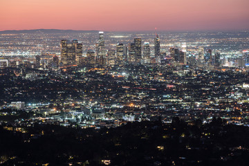 Obraz premium Predawn cityscape view of downtown Los Angeles skyline. Shot from mountaintop at popular Griffith Park in Southern California.