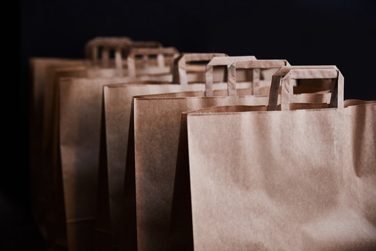 Brown paper bags on a black background