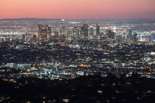 Predawn cityscape view of downtown Los Angeles skyline.  Shot from mountaintop at popular Griffith Park in Southern California.