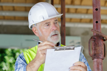 portrait of mature building inspector