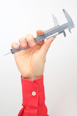 Male hand holds a measuring tool on a white background