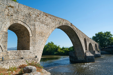 Fototapeta na wymiar Ancient stone bridge at Arta in Pindus Mountains