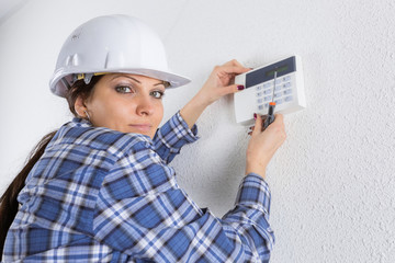 portrait of woman during thermostat base installation