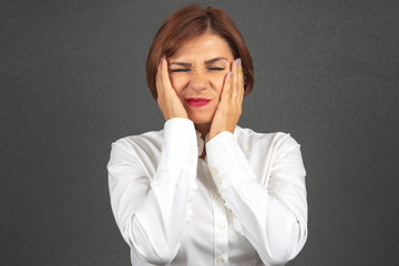 The business woman is tired and worried in emotions. Stress and headache. Working shocks