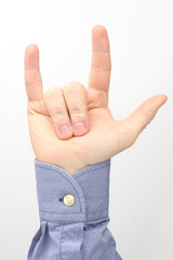 Male hand with three raised fingers on a white background