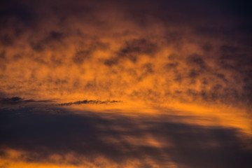 Abstract beautiful sunrise and dramatic clouds on the sky.