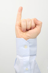 Male hand with raised little finger on a white background