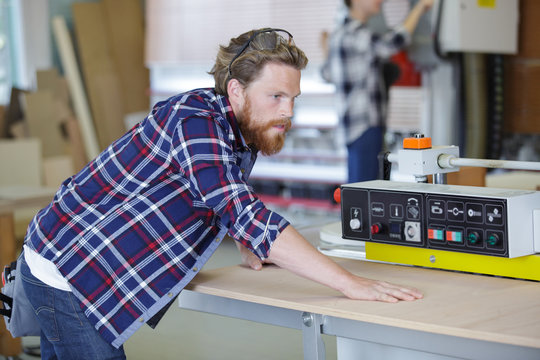 carpenter working in carpentry workshop