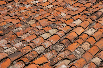 Old red tiles roof background, house roof.