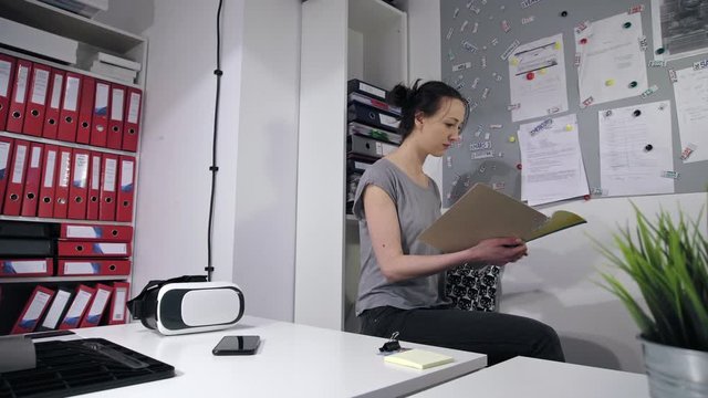 Woman looking at files
