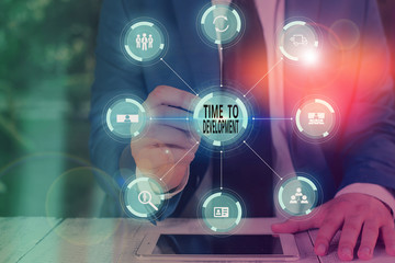 Writing note showing Time To Development. Business concept for a length of time during which a company grows or develop Picture photo network scheme with modern smart device