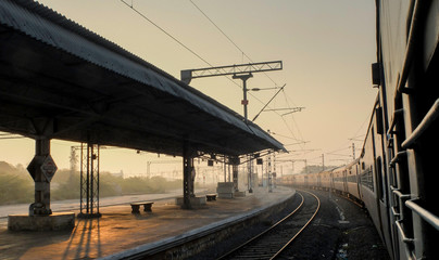 Indian railway train,at station platform,view from window at dawn,Tamil Nadu,India. © Neil