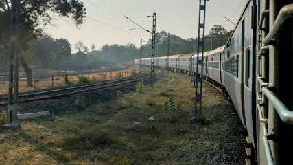 Indian railway train,view from window at dawn,Tamil Nadu,India.