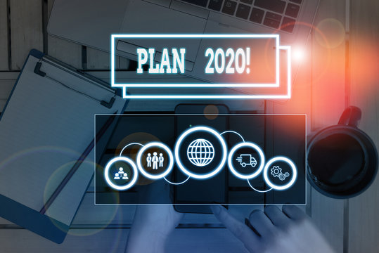 Conceptual hand writing showing Plan 2020. Concept meaning detailed proposal doing achieving something next year Picture photo network scheme with modern smart device