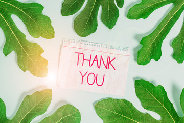 Writing note showing Thank You. Business concept for a polite expression used when acknowledging a...