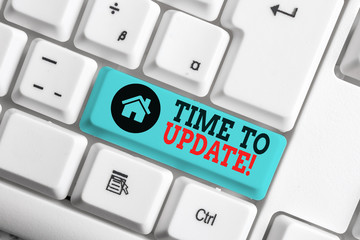 Text sign showing Time To Update. Business photo text this is right moment to make something more modern new White pc keyboard with empty note paper above white background key copy space