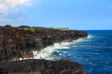Fototapeta na wymiar Black lava sea cliffs