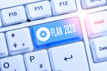 Text sign showing Plan 2020. Business photo showcasing detailed proposal doing achieving something next year White pc keyboard with empty note paper above white background key copy space