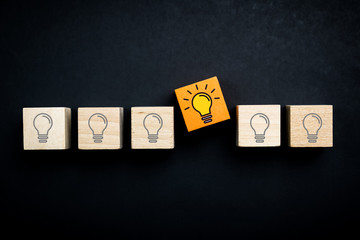 Innovation, creative or new idea concept using wood blocks with lightbulb