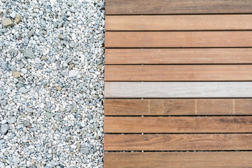 Wood deck floor over the stone sand beach background