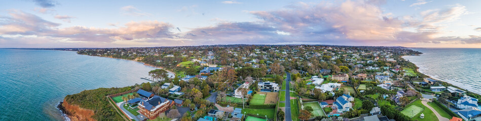 Obraz premium Wide aerial panorama of Mount Eliza suburb on Mornington Peninsula in Melbourne, Australia at sunset