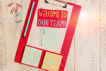 Handwriting text writing Welcome To Our Team. Conceptual photo introducing another demonstrating to your team mates Clipboard sheet crushed sticky note clip notepads marker wooden background