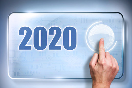 finger presses a button on a touchscreen to load up 2020
