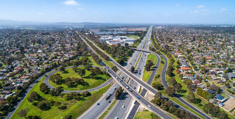 Fototapeta premium Typical road interchange in Melbourne suburbs - aerial panorama