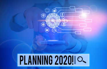 Writing note showing Planning 2020. Business concept for process of making plans for something next...