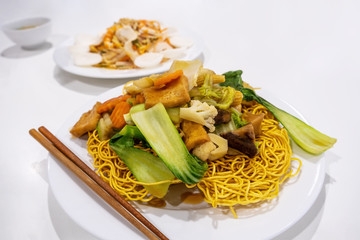 Crispy egg noodles with stir fried vegetables - vegetarian Vietnamese dish