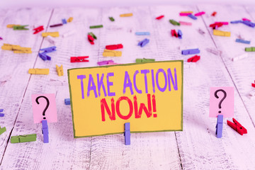 Text sign showing Take Action Now. Business photo text do something official or concerted achieve aim with problem Scribbled and crumbling sheet with paper clips placed on the wooden table