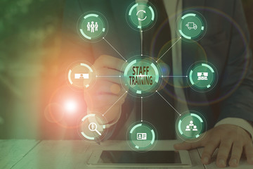 Writing note showing Staff Training. Business concept for program that helps employees learn specific knowledge Picture photo network scheme with modern smart device