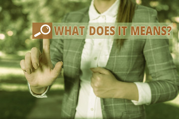 Handwriting text What Does It Means Question. Conceptual photo asking meaning something said and do not understand Business woman in the nature pointing with the finger into empty space