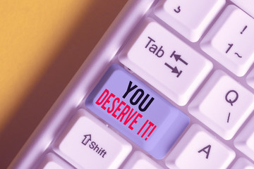 Word writing text You Deserve It. Business photo showcasing should have it because of their qualities or actions White pc keyboard with empty note paper above white background key copy space